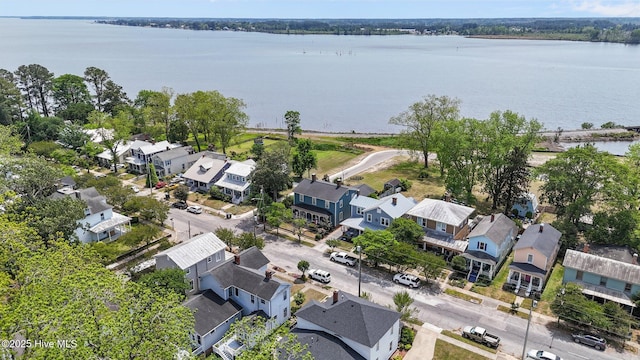 aerial perspective of suburban area with a large body of water
