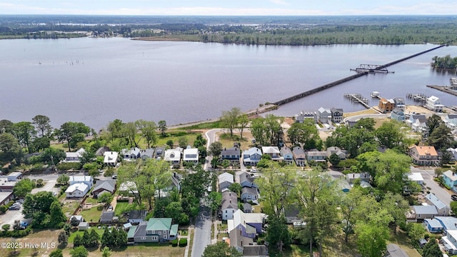 view of property location with a large body of water and nearby suburban area