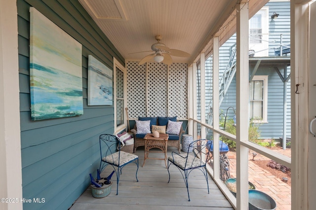 wooden terrace featuring a ceiling fan