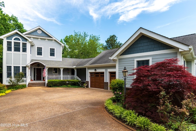 207 Megan Loop S, Hertford, NC 27944 - view of front of property with covered porch, an attached garage, driveway, and roof with shingles