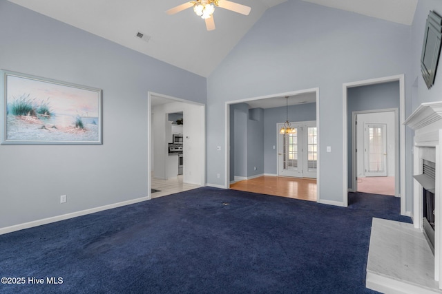 unfurnished bedroom featuring high vaulted ceiling, a fireplace, carpet, a chandelier, and baseboards