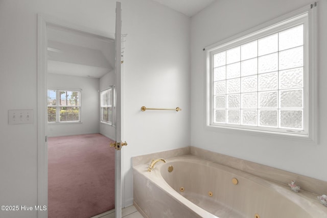 full bathroom featuring a whirlpool tub