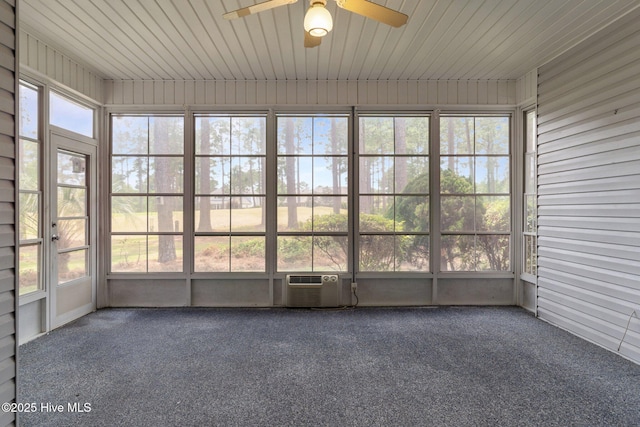 unfurnished sunroom featuring ceiling fan