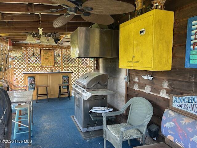 8019 W Tarboro Rd, Rocky Mount, NC 27803 - kitchen with wood walls and a ceiling fan