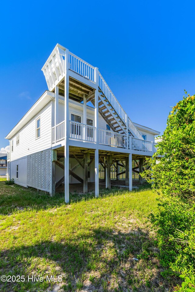 317 Sand Piper Ln, Holden Beach, NC 28462 - back of property with a deck