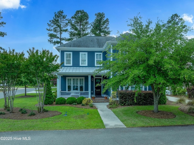 212 Cornubia Dr, Castle Hayne, NC 28429 - view of front facade with a porch, a standing seam roof, a front lawn, a metal roof, and a shingled roof