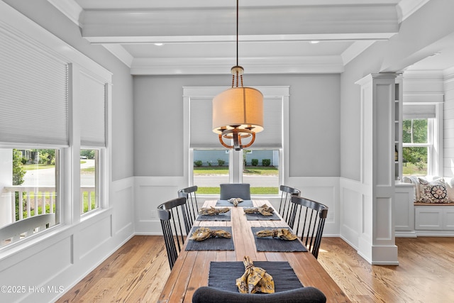 212 Cornubia Dr, Castle Hayne, NC 28429 - dining space with light wood-style floors, a wainscoted wall, a chandelier, beam ceiling, and a decorative wall