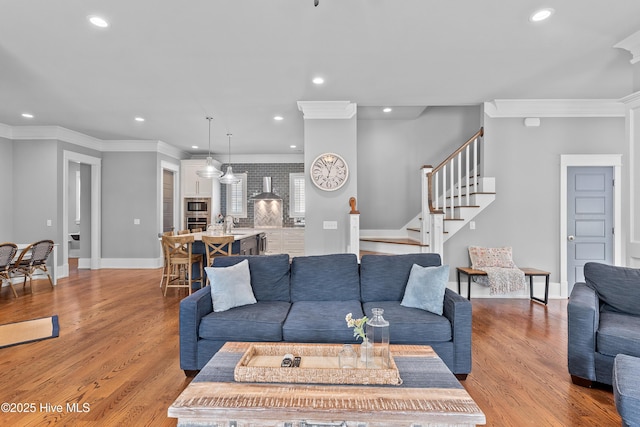 212 Cornubia Dr, Castle Hayne, NC 28429 - living room with light wood-type flooring, recessed lighting, ornamental molding, and stairway