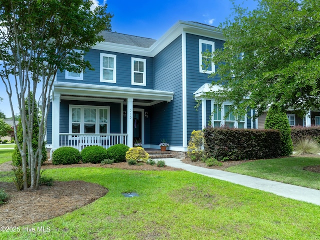 212 Cornubia Dr, Castle Hayne, NC 28429 - view of front of house featuring a porch and a front lawn