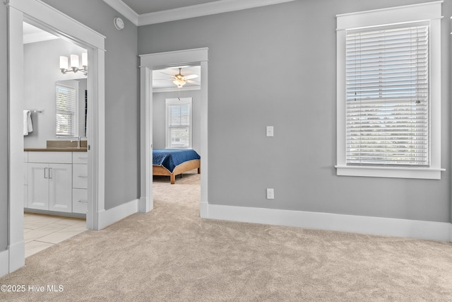 212 Cornubia Dr, Castle Hayne, NC 28429 - unfurnished bedroom featuring light colored carpet, crown molding, and ensuite bath