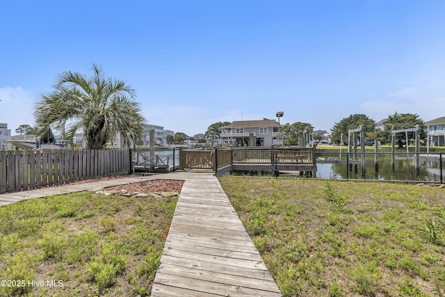 dock featuring a residential view and a water view
