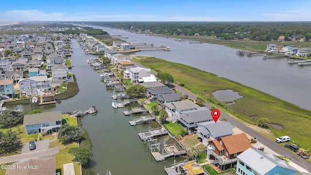 aerial view of property's location with a large body of water