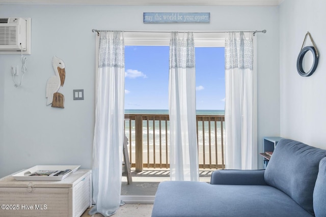 interior space featuring an AC wall unit and a water view