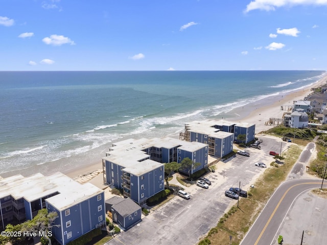 drone / aerial view of waterfront with a beach