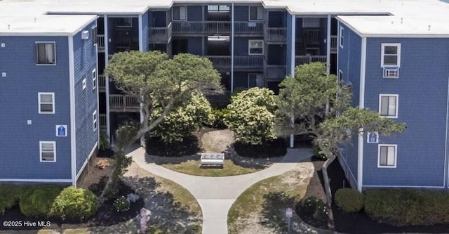aerial view of property and surrounding area with apartment complex / building