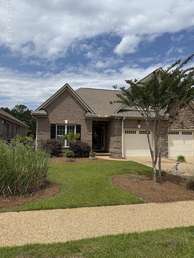 view of front of house with brick siding, a front yard, a garage, concrete driveway, and roof with shingles