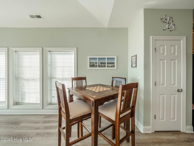 4388 Island Dr, North Topsail Beach, NC 28460 - dining room featuring light wood-style flooring and baseboards