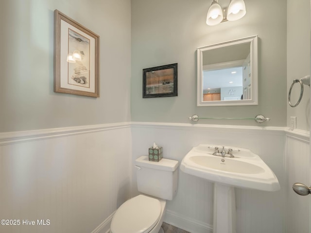 4388 Island Dr, North Topsail Beach, NC 28460 - bathroom featuring a wainscoted wall and toilet