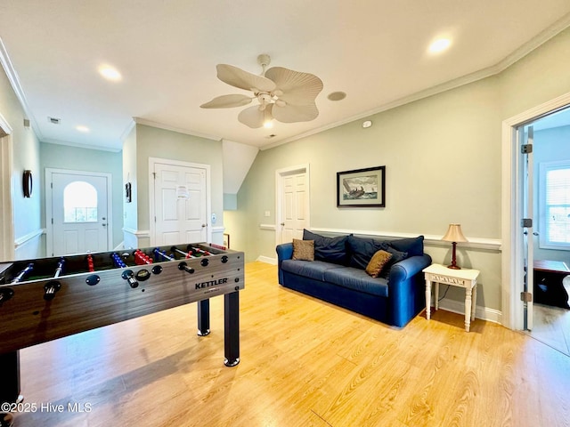 4388 Island Dr, North Topsail Beach, NC 28460 - game room with crown molding, light wood-style flooring, ceiling fan, healthy amount of natural light, and baseboards