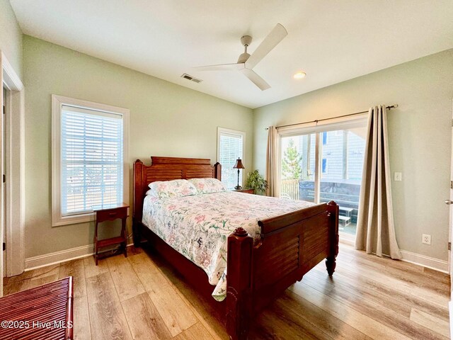 4388 Island Dr, North Topsail Beach, NC 28460 - bedroom with access to exterior, multiple windows, light wood-type flooring, baseboards, and recessed lighting