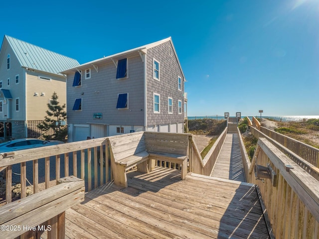 4388 Island Dr, North Topsail Beach, NC 28460 - rear view of house featuring an attached garage and a wooden deck