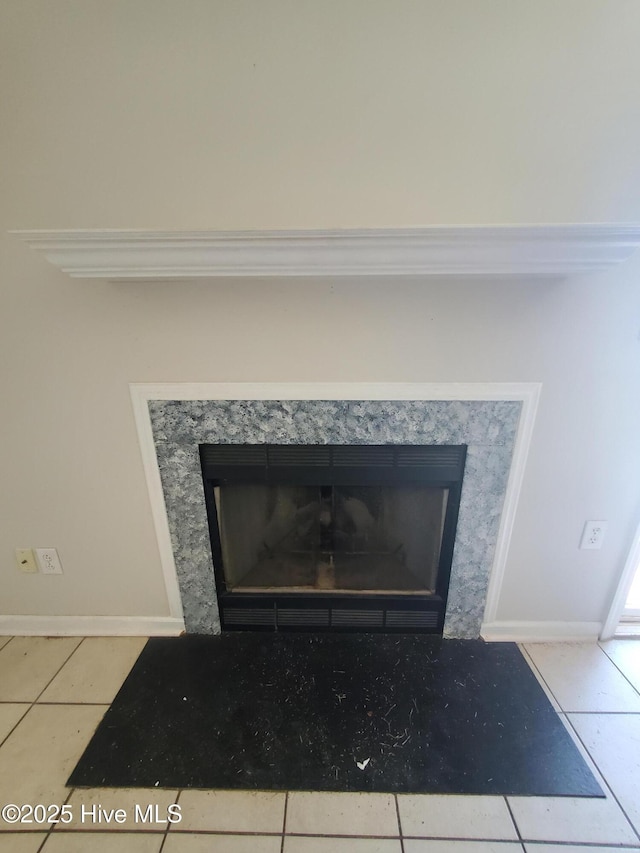 detailed view of a premium fireplace and baseboards