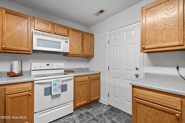 kitchen with white appliances and light countertops