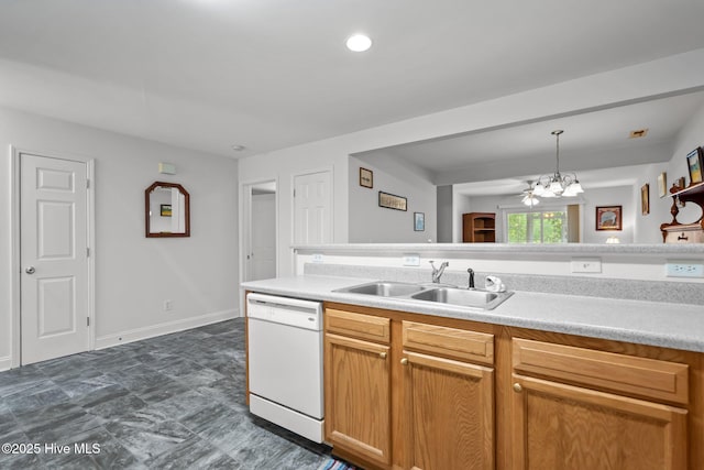 kitchen featuring dishwasher, a sink, a chandelier, light countertops, and hanging light fixtures
