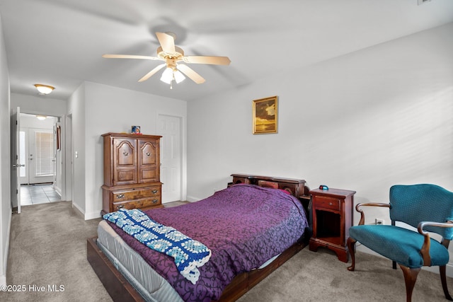 bedroom featuring carpet floors, baseboards, and ceiling fan