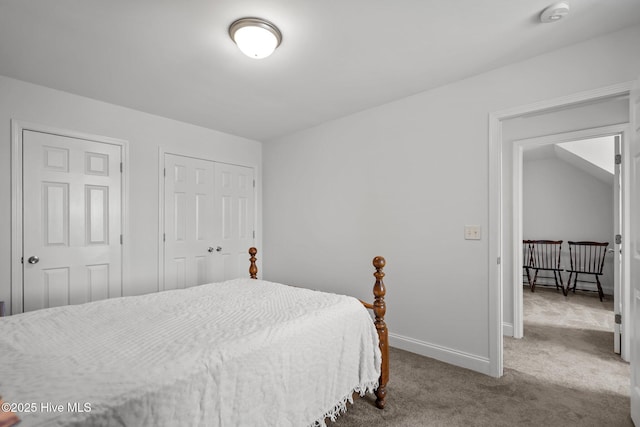 carpeted bedroom with baseboards