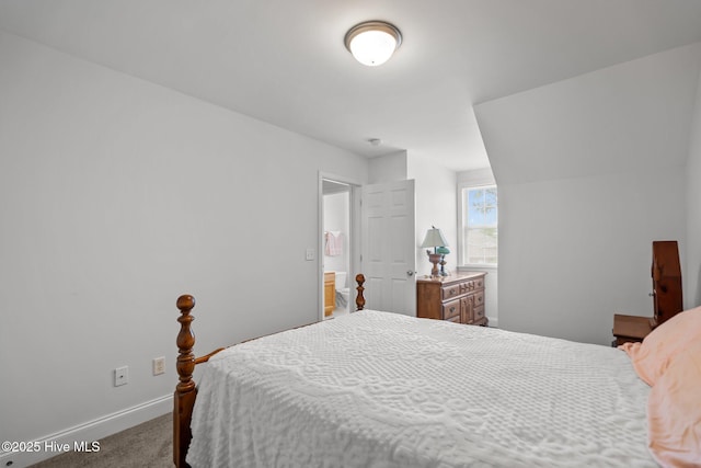 bedroom with carpet floors and baseboards