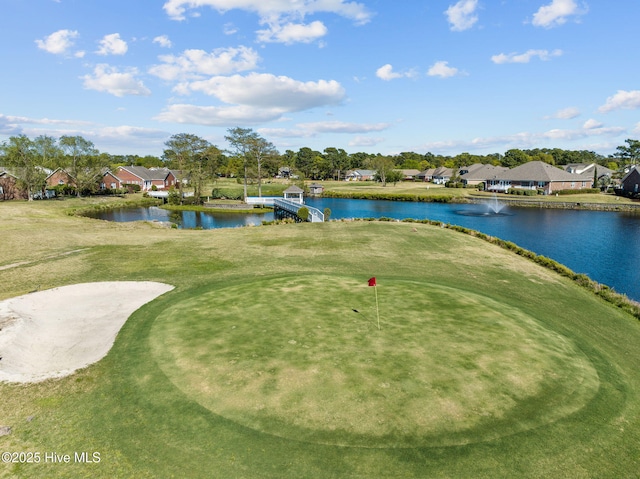 view of home's community featuring a water view, golf course view, and a residential view