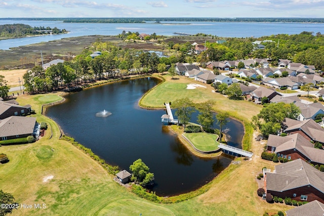 aerial view of property's location with nearby suburban area, a nearby body of water, and a golf club