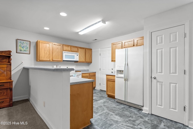 kitchen with white appliances, a peninsula, recessed lighting, baseboards, and light countertops