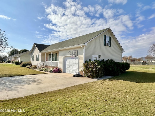 207 Rhonda Rd, Elizabeth City, NC 27909 - view of side of home featuring an attached garage, concrete driveway, a yard, and cooling unit