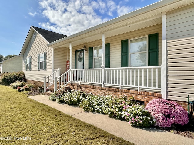 207 Rhonda Rd, Elizabeth City, NC 27909 - view of front of house featuring a porch and a front lawn