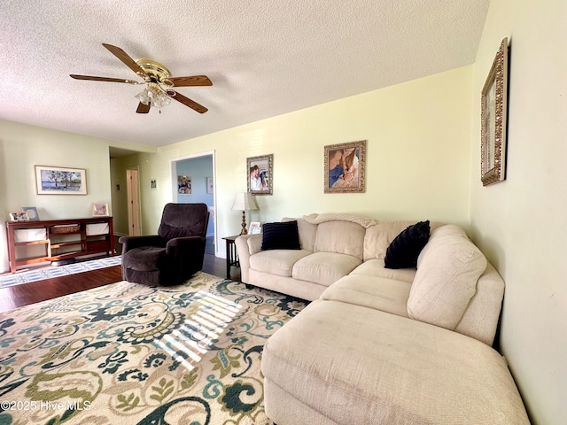 207 Rhonda Rd, Elizabeth City, NC 27909 - living area featuring wood finished floors, a textured ceiling, and a ceiling fan