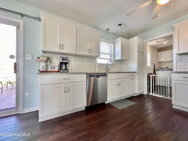 207 Rhonda Rd, Elizabeth City, NC 27909 - kitchen with dishwasher, dark wood finished floors, tasteful backsplash, light stone countertops, and white cabinetry