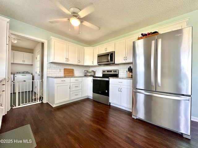 207 Rhonda Rd, Elizabeth City, NC 27909 - kitchen featuring appliances with stainless steel finishes, dark wood-style floors, separate washer and dryer, ceiling fan, and a textured ceiling