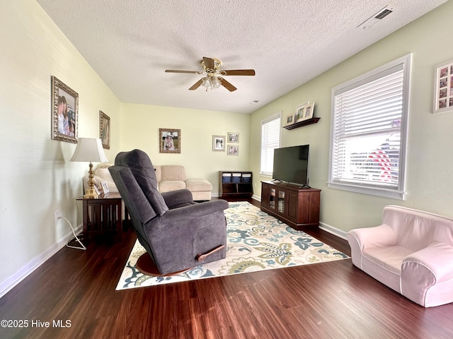 207 Rhonda Rd, Elizabeth City, NC 27909 - living area featuring wood finished floors, a ceiling fan, baseboards, and a textured ceiling