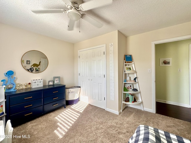 207 Rhonda Rd, Elizabeth City, NC 27909 - bedroom with carpet, a textured ceiling, a closet, and ceiling fan