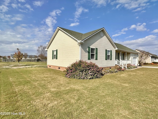 207 Rhonda Rd, Elizabeth City, NC 27909 - view of side of home with crawl space, an attached garage, a lawn, and driveway