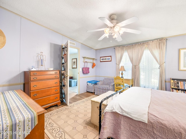 366 Ampersand Rd, Aberdeen, NC 28315 - bedroom with a textured ceiling, wood finished floors, ceiling fan, and vaulted ceiling