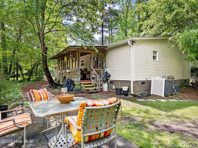 366 Ampersand Rd, Aberdeen, NC 28315 - back of house featuring crawl space and outdoor dining space