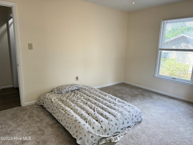 3306 E Oak Island Dr, Oak Island, NC 28465 - bedroom featuring carpet flooring and baseboards