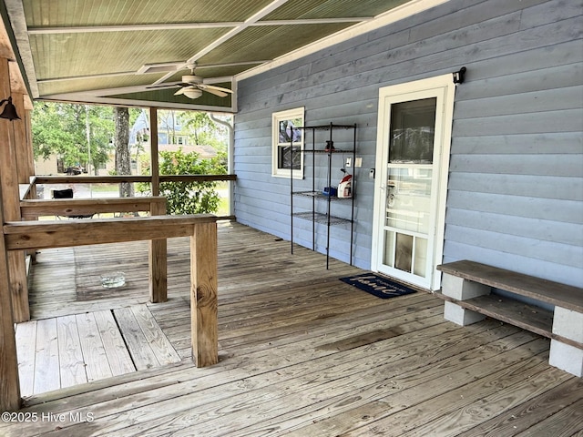 3306 E Oak Island Dr, Oak Island, NC 28465 - wooden deck featuring ceiling fan