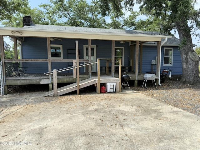 3306 E Oak Island Dr, Oak Island, NC 28465 - back of property featuring a chimney