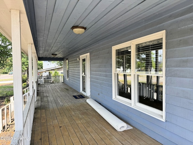 3306 E Oak Island Dr, Oak Island, NC 28465 - wooden terrace featuring a porch
