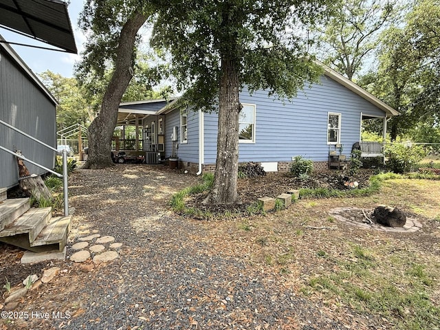 3306 E Oak Island Dr, Oak Island, NC 28465 - view of side of home featuring cooling unit