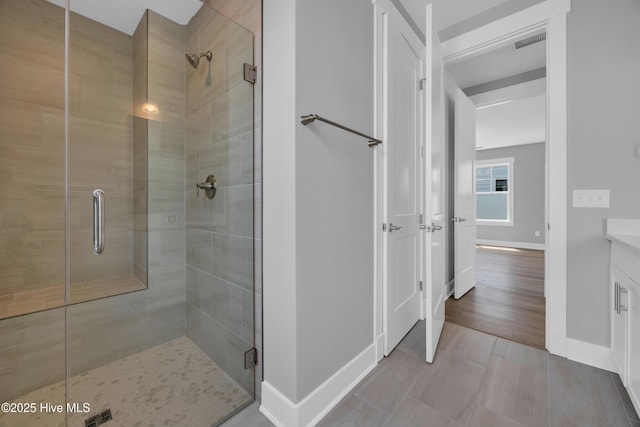 1961 Indigo Cove Way, Calabash, NC 28467 - full bath featuring baseboards, a stall shower, vanity, and tile patterned floors